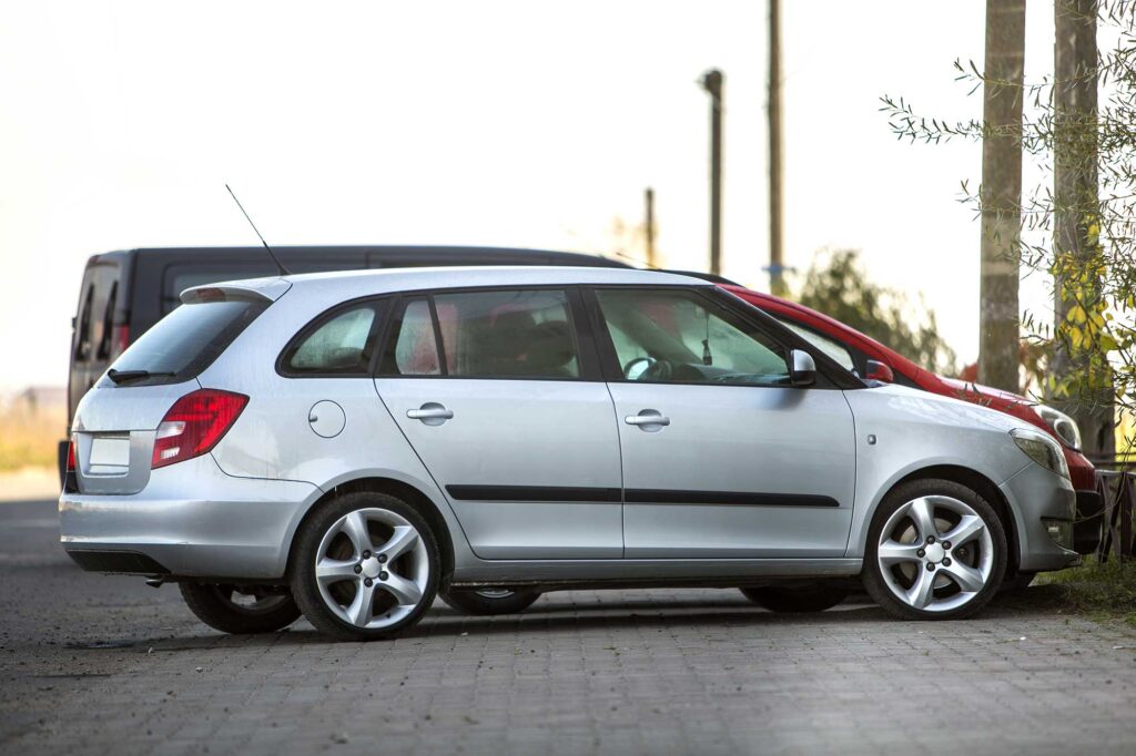 side-view-of-silver-shiny-luxurious-car-parked-on-2022-09-12-17-36-39-utc-1.jpg